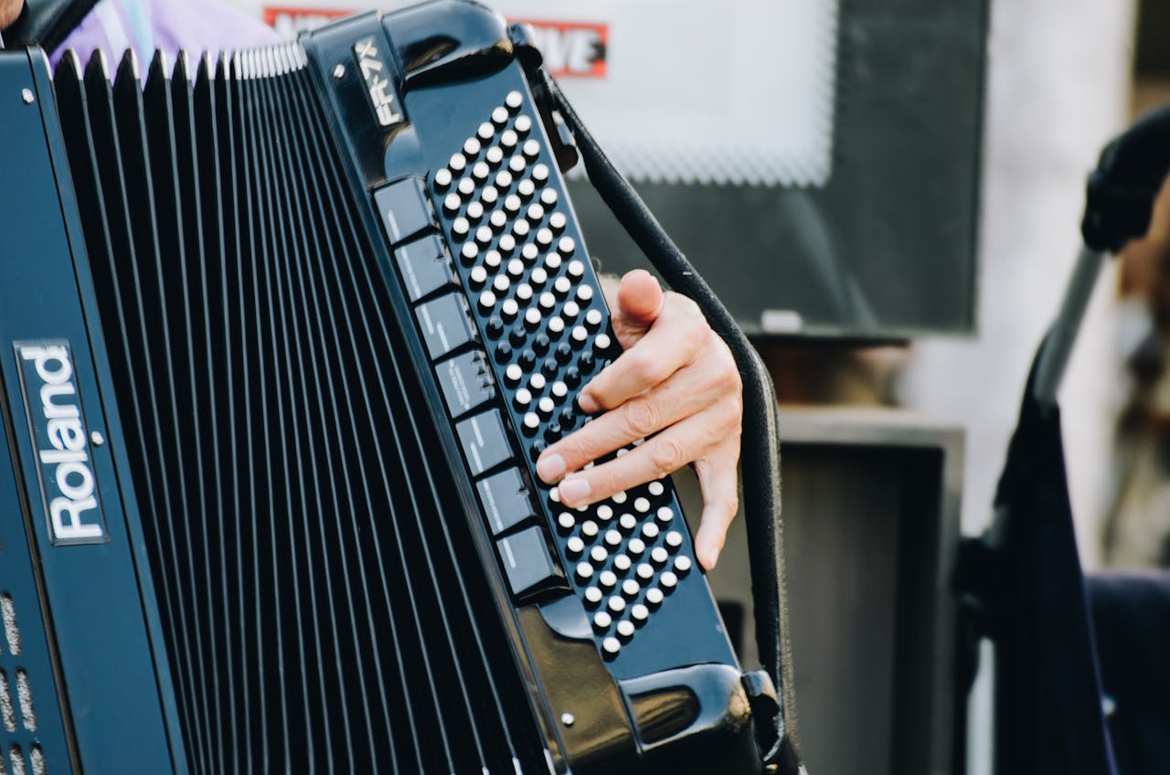 Close-up of a street musician's hands playing an accordion in Nuremberg, Germany.